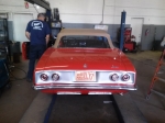 Back view red convertible auto mechanics Scottsdale Muffler