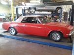 Side view of classic red car custom muffler