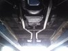 Custom exhaust system installation on classic AZ hearse car