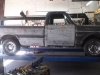 Classic pickup truck in Arizona placed on a auto mechanics lift