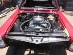 Under hood of a red classic car auto services Tempe AZ