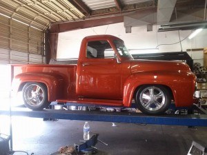 Classic Orange Truck on Scottsdale Muffler & Automotive's Lift